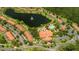 Community aerial showcasing landscaped grounds, swimming pools, and winding roads at 3019 White Orchid Rd, Kissimmee, FL 34747