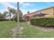 A manicured backyard with palm trees and covered patios offering outdoor living at 3019 White Orchid Rd, Kissimmee, FL 34747
