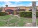A lush backyard featuring well-maintained greenery and private screened patios at 3019 White Orchid Rd, Kissimmee, FL 34747