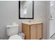 Powder room features a toilet, vanity with light wood cabinets, and a mirror at 3019 White Orchid Rd, Kissimmee, FL 34747