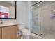 Bathroom featuring a glass enclosed shower and a vanity with a mirror at 3019 White Orchid Rd, Kissimmee, FL 34747