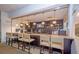 Modern clubhouse bar featuring granite countertop and a wide selection of beverages at 3019 White Orchid Rd, Kissimmee, FL 34747