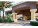 The grand entrance to the Encantada clubhouse with stately columns and porte-cochere at 3019 White Orchid Rd, Kissimmee, FL 34747