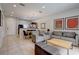 Open concept living room with tile floors and dining area with natural light at 3019 White Orchid Rd, Kissimmee, FL 34747