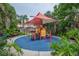 Colorful playground featuring a sunshade and various play structures at 3019 White Orchid Rd, Kissimmee, FL 34747