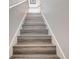 Stairway with modern wood look flooring at 3019 White Orchid Rd, Kissimmee, FL 34747