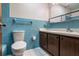 Vintage blue tile bathroom featuring updated vanity and sink, blending retro charm with modern updates at 3121 Thistlehill Drive, Winter Park, FL 32792