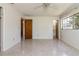 Bright bedroom featuring dual entryways and a window overlooking the yard at 3121 Thistlehill Drive, Winter Park, FL 32792