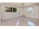 Bedroom featuring dual windows for ample natural light at 3121 Thistlehill Drive, Winter Park, FL 32792