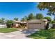 Beautiful home with a well-maintained lawn, mature trees, and a two-car garage at 3121 Thistlehill Drive, Winter Park, FL 32792