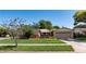 Charming single-story home with well-manicured lawn and mature landscaping at 3121 Thistlehill Drive, Winter Park, FL 32792