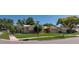 Corner lot featuring a well-kept lawn and a charming single-story home at 3121 Thistlehill Drive, Winter Park, FL 32792
