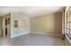 Spacious living room featuring light terrazzo floors and ample natural light at 3121 Thistlehill Drive, Winter Park, FL 32792