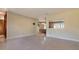 Open-concept living space with terrazzo floors connecting the dining area and living room at 3121 Thistlehill Drive, Winter Park, FL 32792