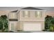 Charming two-story home featuring a two-car garage and traditional design elements at 3229 Ellsworth Ave, Davenport, FL 33837