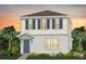Charming two-story home showcasing a well-manicured lawn and a welcoming covered entryway at 3304 Orange Rose Loop, Apopka, FL 32712