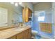 Cozy bathroom features single vanity sink and glass enclosed shower at 34239 Woodridge Ln, Eustis, FL 32736