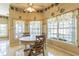 Cozy breakfast nook features large windows overlooking the backyard at 34239 Woodridge Ln, Eustis, FL 32736