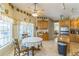 Bright eat-in kitchen with natural light and decorative wall plates at 34239 Woodridge Ln, Eustis, FL 32736