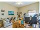 Inviting home office setup with desk, seating, and decor at 34239 Woodridge Ln, Eustis, FL 32736