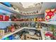 Walk-in pantry filled with shelves of cooking ingredients and cookware at 34239 Woodridge Ln, Eustis, FL 32736