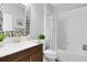 Bathroom featuring a vanity, decorative mirror, and a shower-tub combination at 3630 Trimaran Dr, Orlando, FL 32820