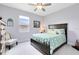 Beautiful bedroom with a ceiling fan and natural lighting from the window at 3630 Trimaran Dr, Orlando, FL 32820