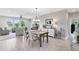 Bright dining room with wood flooring, chandelier lighting, adjacent to living room, and abundant natural light at 3630 Trimaran Dr, Orlando, FL 32820
