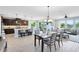 Open floor plan featuring the kitchen with an island and bar seating, dining area, and bright living room at 3630 Trimaran Dr, Orlando, FL 32820