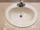 Close-up of bathroom sink with polished chrome faucet and speckled granite countertop at 3658 Oakdale Cir # 100, Oviedo, FL 32765