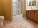 Bathroom with tiled floors, a bathtub and shower, and a mirrored vanity at 3658 Oakdale Cir # 100, Oviedo, FL 32765