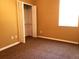 Empty bedroom featuring a large closet, neutral paint, and plush carpet at 3658 Oakdale Cir # 100, Oviedo, FL 32765