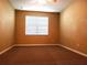 Bedroom featuring neutral paint, a large window, ceiling fan, and plush carpet at 3658 Oakdale Cir # 100, Oviedo, FL 32765