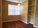 Dining area featuring wood floors, built-in shelves and a large window at 3658 Oakdale Cir # 100, Oviedo, FL 32765