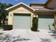 A two-car garage offers convenient parking and storage at 3658 Oakdale Cir # 100, Oviedo, FL 32765
