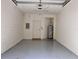 Spacious garage interior with painted walls and floor at 3658 Oakdale Cir # 100, Oviedo, FL 32765