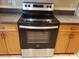 Kitchen featuring a stainless steel and black stove with electric cooktop and oven at 3658 Oakdale Cir # 100, Oviedo, FL 32765