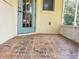 This patio features attractive tile flooring and a screen door to provide a comfortable outdoor space at 3658 Oakdale Cir # 100, Oviedo, FL 32765