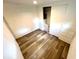 Bedroom with wood-look flooring, built-in storage drawers and a closet at 40431 Country Rd, Eustis, FL 32736