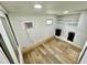 Bedroom featuring wood-look flooring and a small closet with shelving at 40431 Country Rd, Eustis, FL 32736
