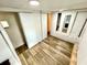 A bedroom with an opening to another room and a closet at 40431 Country Rd, Eustis, FL 32736
