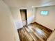 Bedroom with wood-look flooring, built-in storage drawers and a closet at 40431 Country Rd, Eustis, FL 32736