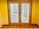 Glass doors with blinds leading to an outside area at 40431 Country Rd, Eustis, FL 32736