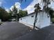 Exterior view of a white building with a black paved area, showcasing the building's simplistic design at 40431 Country Rd, Eustis, FL 32736
