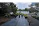 Property featuring an outdoor area with trees, plants in pots, greenery and a glimpse of the building at 40431 Country Rd, Eustis, FL 32736