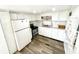 Functional kitchen with stainless steel appliances, bright countertops, and ample cabinet space at 40431 Country Rd, Eustis, FL 32736