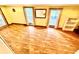 Bright living room with neutral walls, wood-look flooring, and lots of natural light at 40431 Country Rd, Eustis, FL 32736