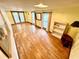 Living room featuring wood-look floors, neutral walls, and lots of natural light at 40431 Country Rd, Eustis, FL 32736