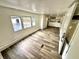 Comfortable living space with multiple windows, adjacent to the kitchen and other areas of the home at 40431 Country Rd, Eustis, FL 32736