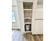 Showing the water heater in the built-in, walk-in storage next to the kitchen at 40431 Country Rd, Eustis, FL 32736